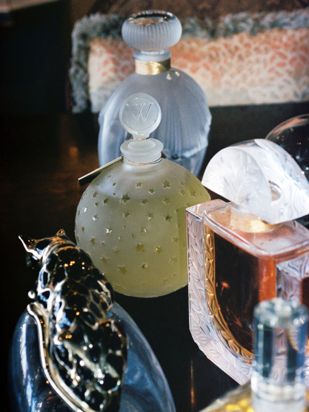 Image may contain Bottle Cosmetics Perfume Helmet Adult and Person